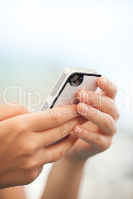 Child checking a text message on a mobile