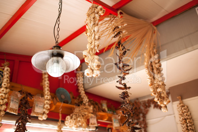 Garlic and Peppers Hanging from Ceiling In Market