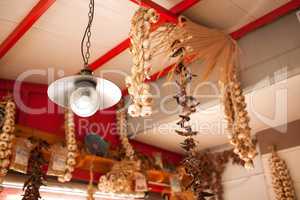 Garlic and Peppers Hanging from Ceiling In Market