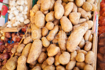 Brown Skin Potatoes Piled in Crates at Food Market