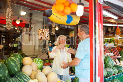Couple shopping in a fruit and vegetable store