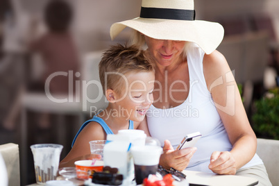 Grandmother and Grandson Using Cell Phone Together