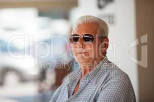 Portrait of elderly man in sunglasses