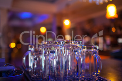Clean glassware on the counter of a nightclub