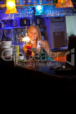 Attractive woman celebrating in a night club