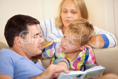Father reading to his young son