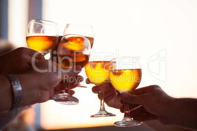 Group of people toasting with white wine