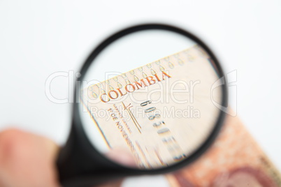 Magnifying Glass on the Colombian Pesos.