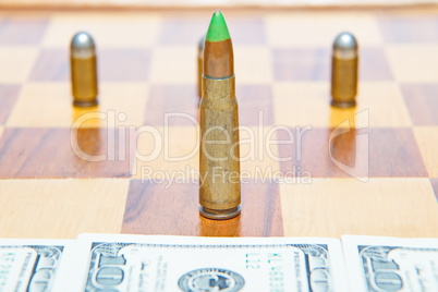 Bullet instead of chess piece. Concept of military power