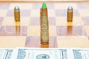 Bullet instead of chess piece. Concept of military power