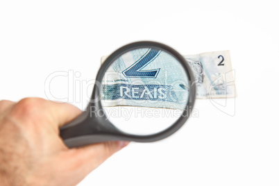 Magnifying Glass on the two Brazilian Reals.