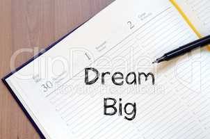 Dream big write on notebook