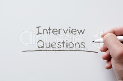 Interview questions written on whiteboard