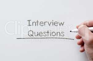 Interview questions written on whiteboard