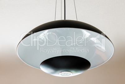 Elegant ceiling lamp with glass lampshade.