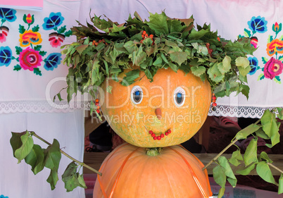 A fun figurine made of two pumpkins in the form of a girl.