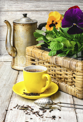 tea and flower pansy