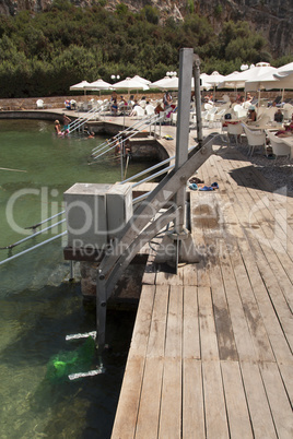 Disabled person pool lift meets installed by swimming lake to lower people into water photo