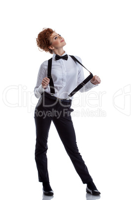 Flirtatious female dancer dressed in formal suit