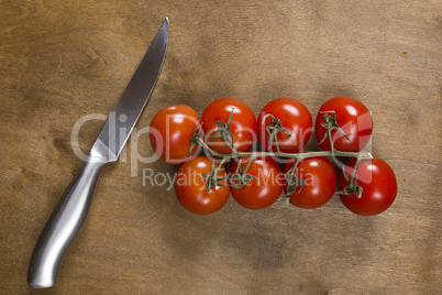 Tomato branch on vintage wood table