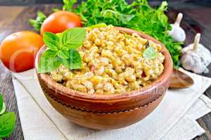 Barley porridge with basil on board