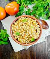 Barley porridge with basil on napkin top