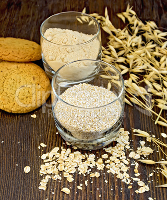 Bran and flour oat in glass with cookies on board