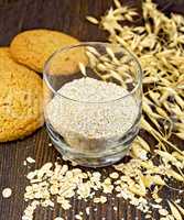 Bran small oat in glass with cookies on board