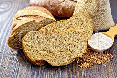 Bread buckwheat with cereals and flour in spoon on board