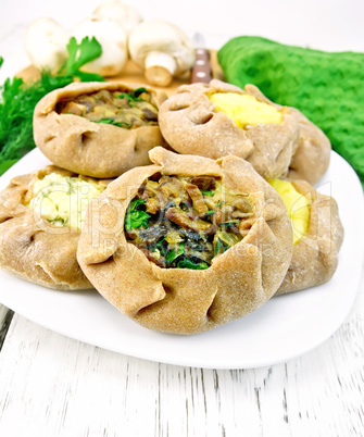 Carols with different fillings and parsley on light board