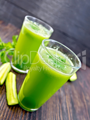 Juice cucumber in two glass on board