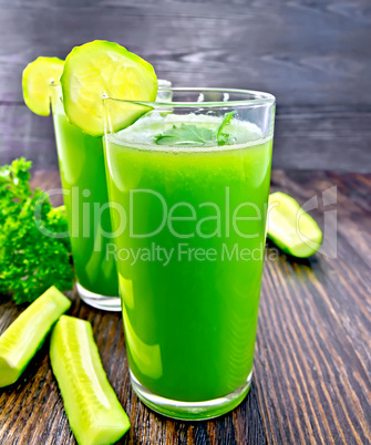 Juice cucumber in two tall glass on board