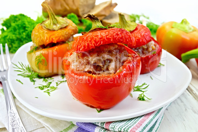 Pepper stuffed meat and rice in plate on table