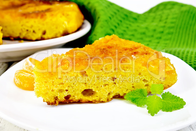 Pie mandarin with mint and green napkin on board