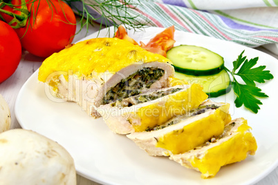 Roll chicken with mushrooms and cucumber on board
