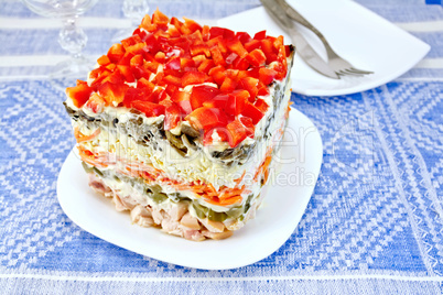 Salad with chicken and pepper on table