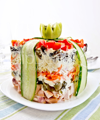 Salad with chicken and peppers on striped napkin