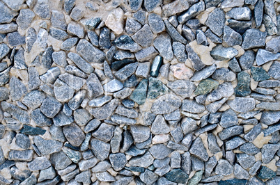 Wall of gray granite gravel