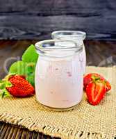 Yogurt with strawberries and mint on sacking