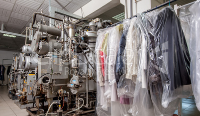 Image of modern equipment and clothing on hangers