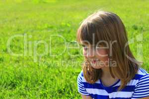 portrait of girl on the green grass background