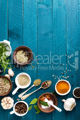 culinary background with spices on wooden table