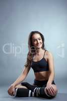 Shot of smiling pilates trainer posing at camera