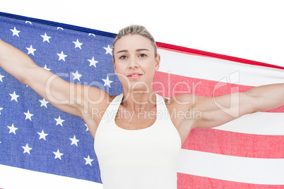 Female athlete holding American flag