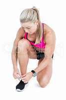 Female athlete tying her shoelace