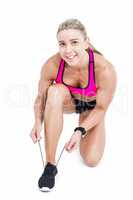 Female athlete tying her shoelace