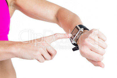 Female athlete using her smart watch