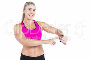 Female athlete using her smart watch