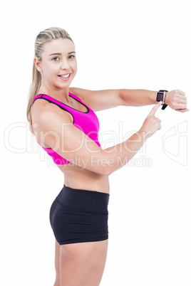 Female athlete using her smart watch