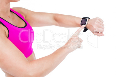 Female athlete using her smart watch